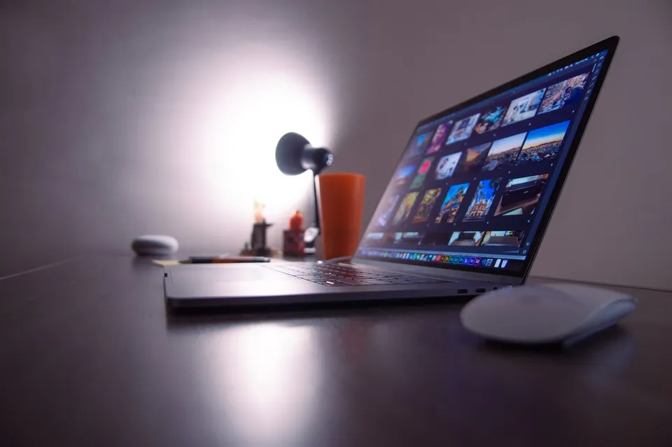 Laptop displaying a website design workspace